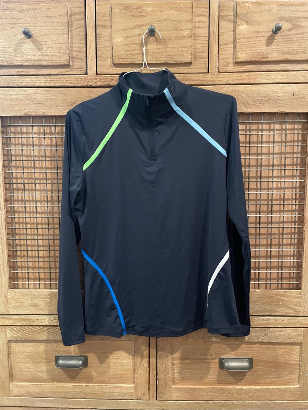 G/Fore woman’s  Blue & Green golf 1/4 zip with blue and green Accents